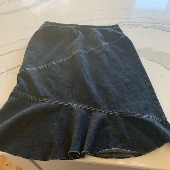 Super Cute Jean skirt with tie in the front. Zipper on the side. Some stretch. - Picture 2 of 4
